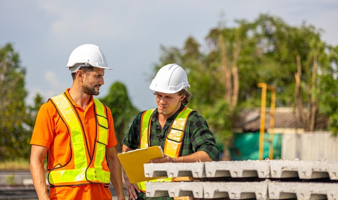 How Can SMEs Remove Bottlenecks from Core Processes? 1 Construction team reviewing plans to remove process bottlenecks