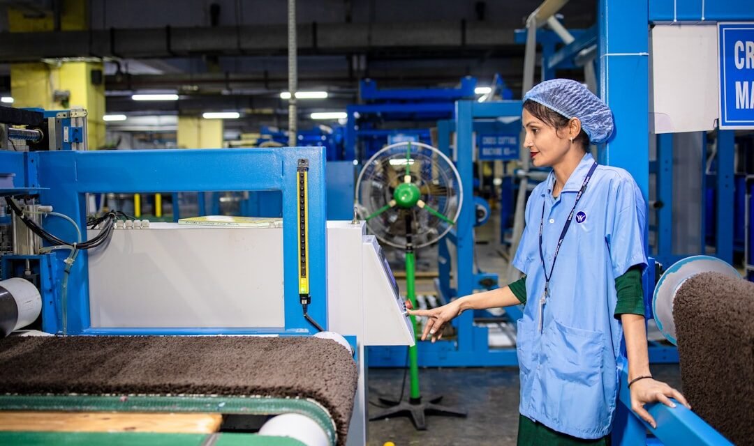 Factory worker checking quality to measure operational performance