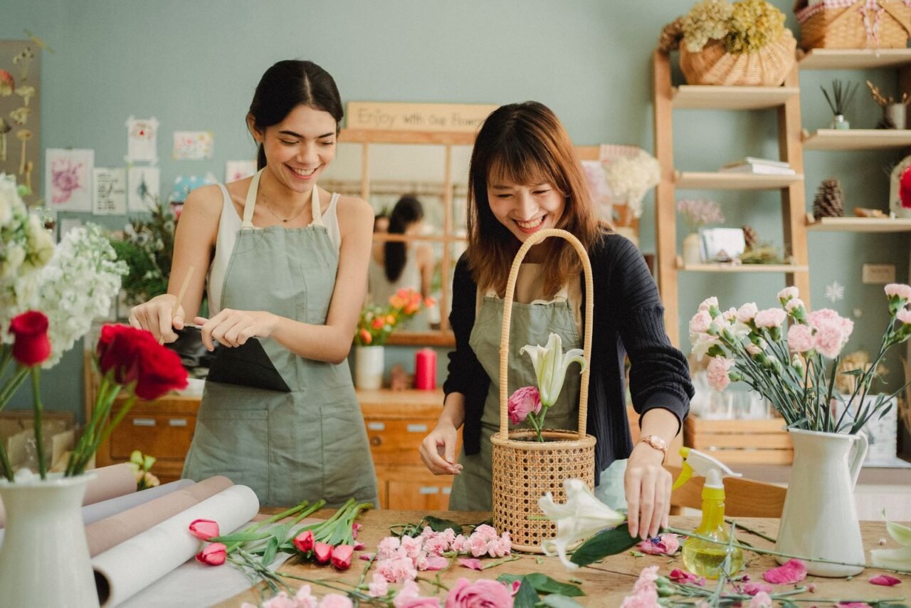 What Is Process Improvement and Where Should You Start? 3 Florists improving order preparation in a small business workshop
