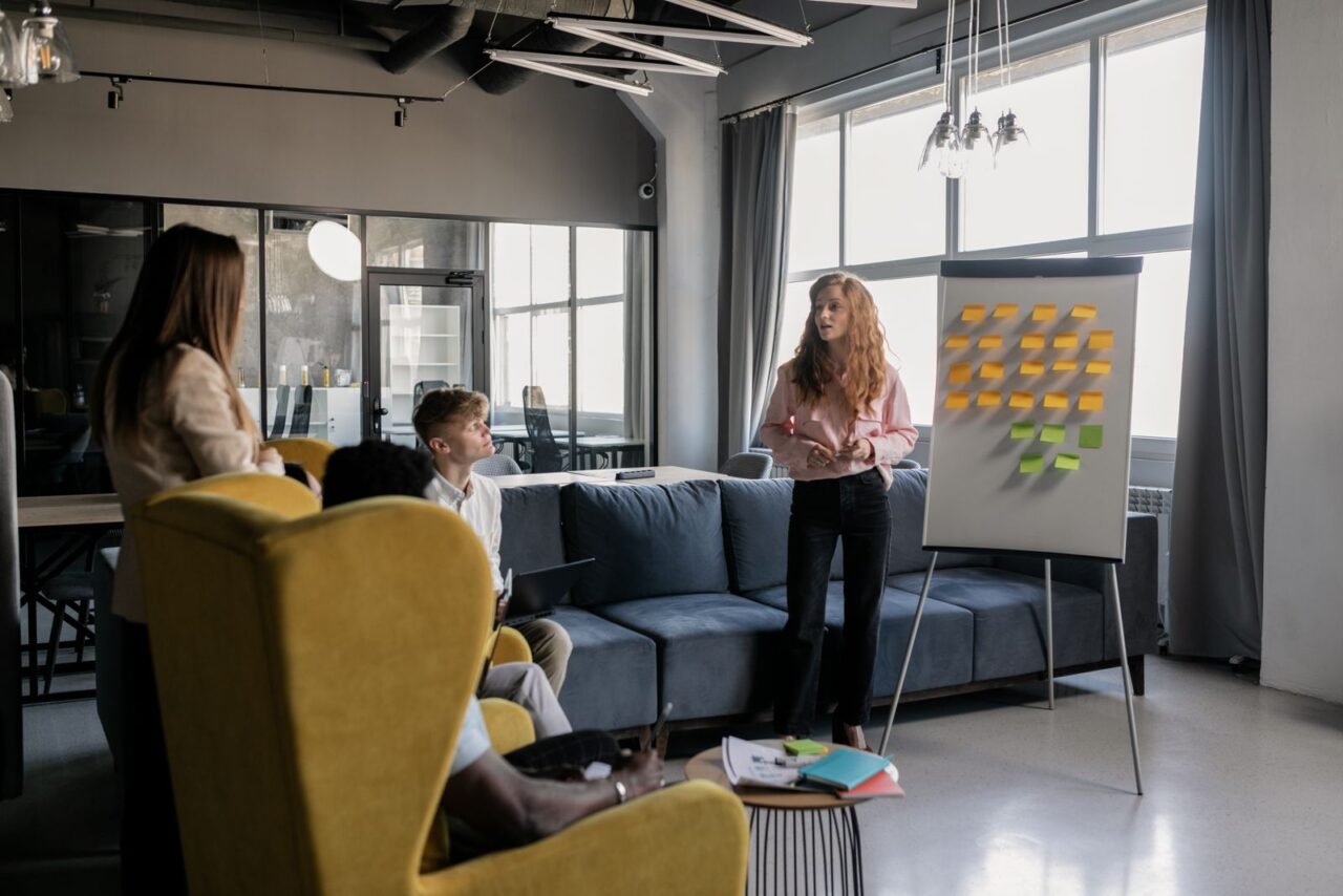 How Do You Identify the Root Causes of Low Productivity? 3 Team mapping possible causes of a productivity problem on a whiteboard