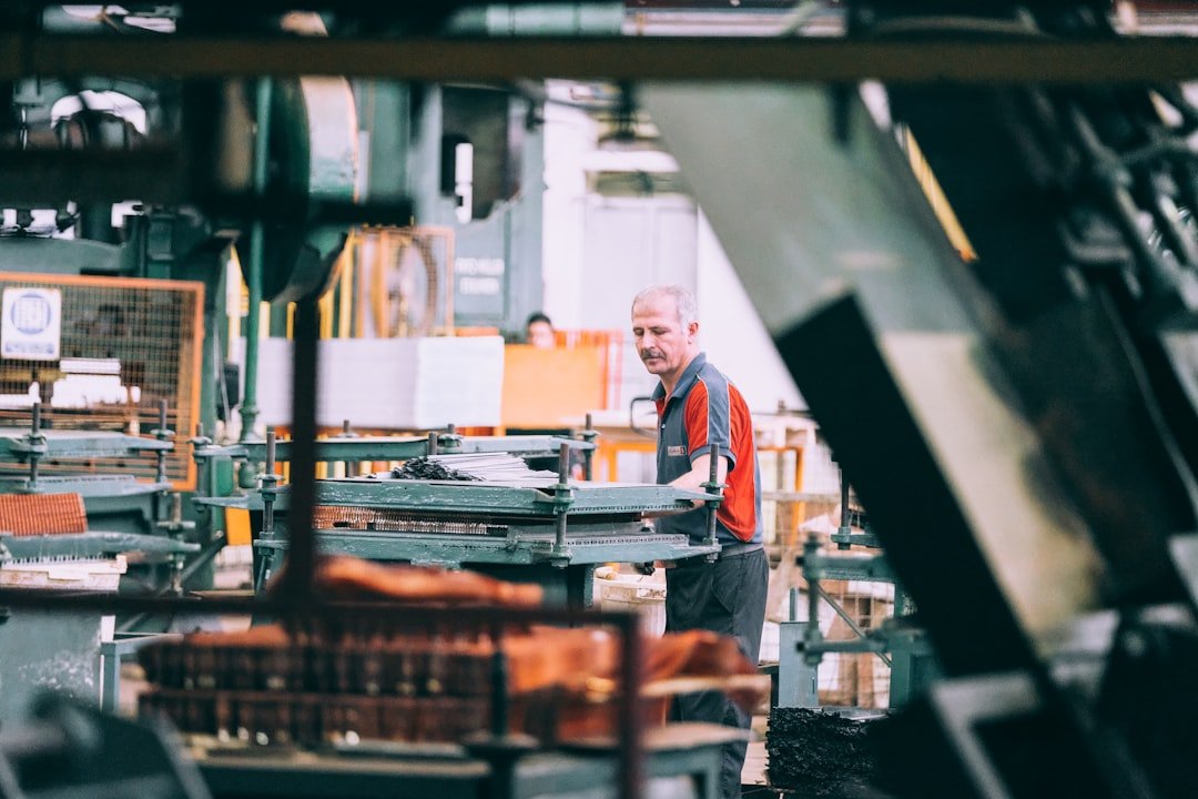 How Can a Business Protect Profit Margins During Rising Costs? 3 manufacturer improving production efficiency as input costs rise