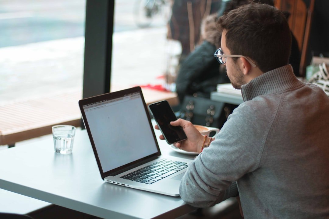 How Do You Build an Executive Performance Dashboard? 2 small business owner reviewing performance data on a laptop