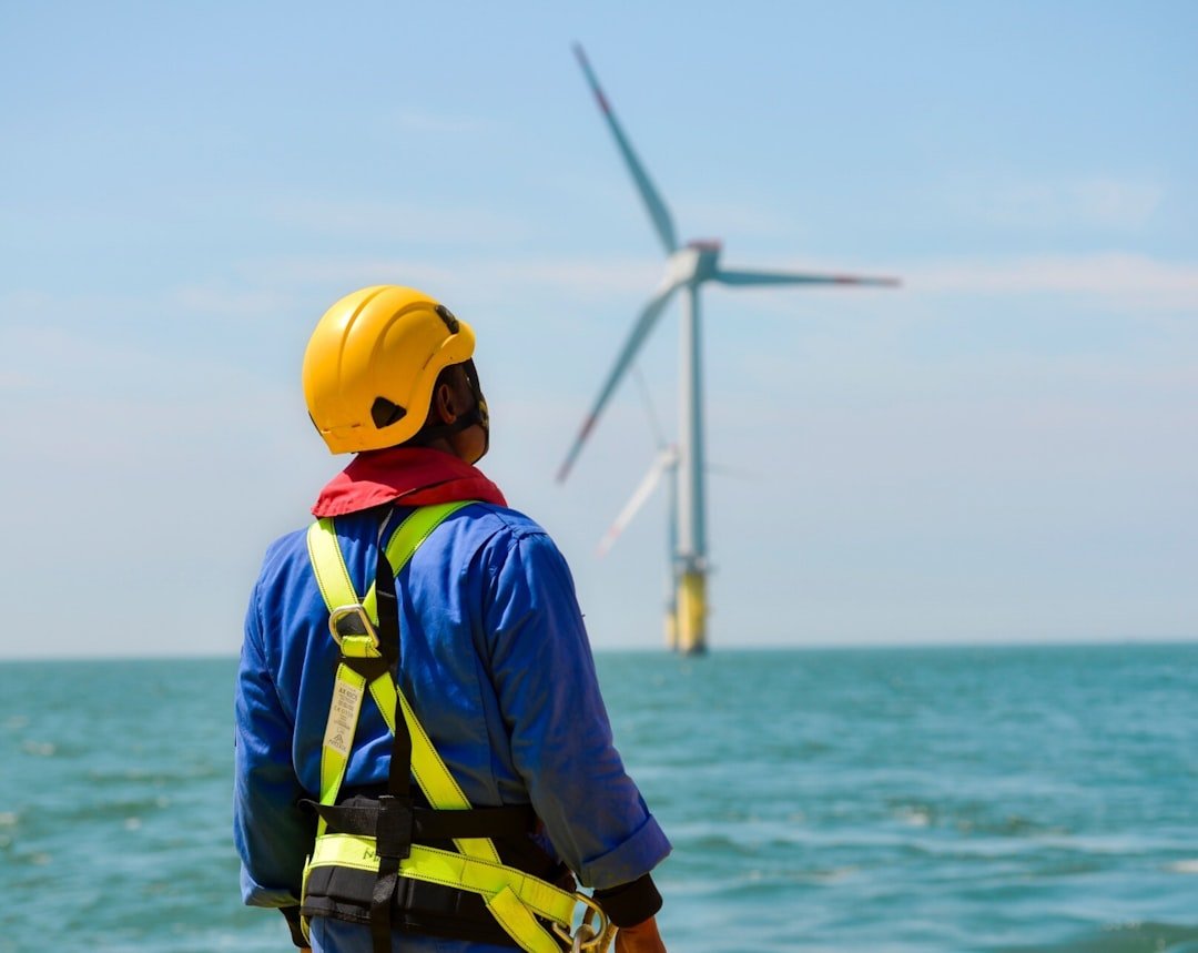 What Is the Difference Between a KPI and a Metric? 3 technician monitoring wind turbine maintenance performance